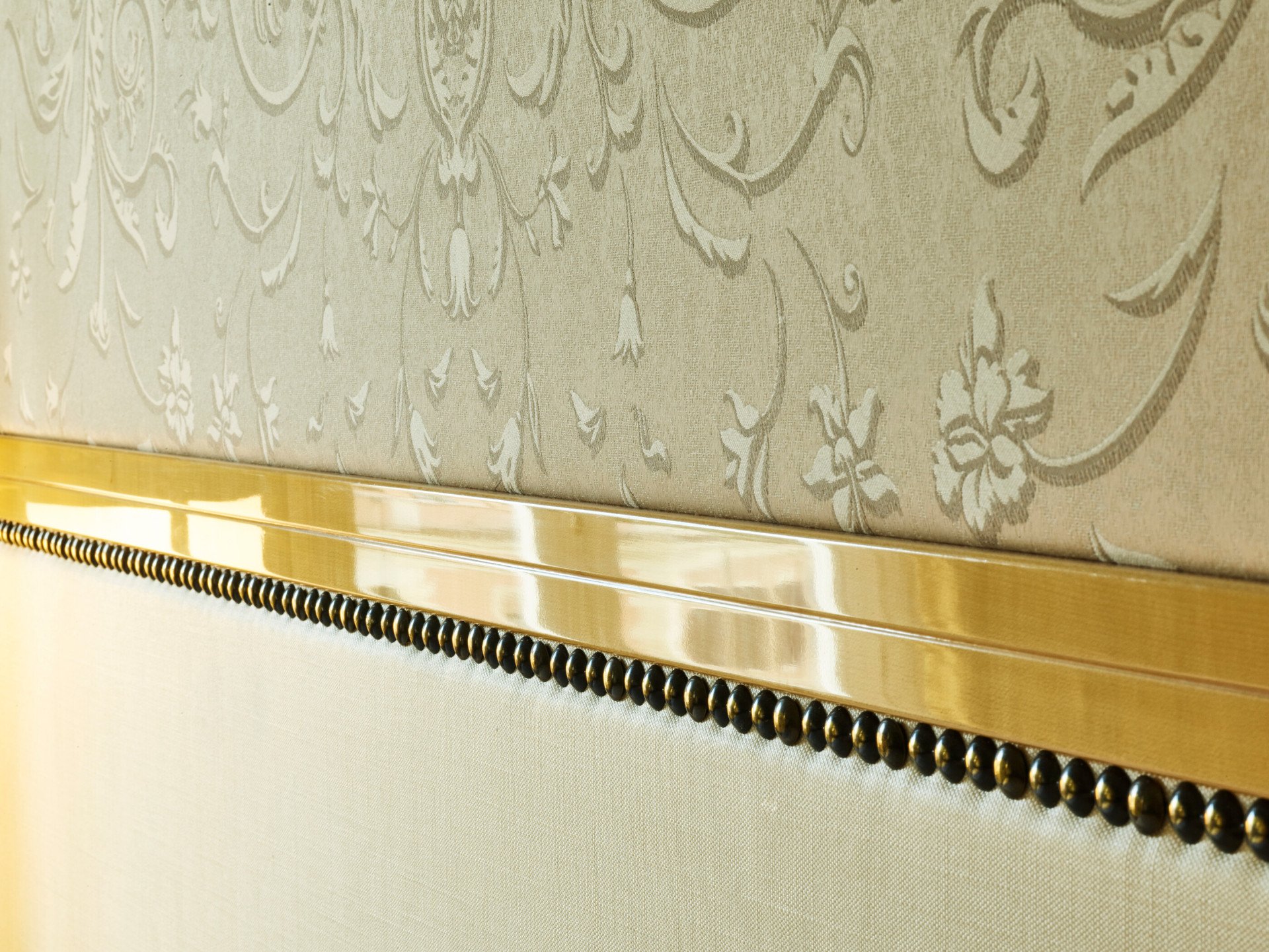 Detail of bed headboard inside Junior Suite at Hotel Eden, Rome