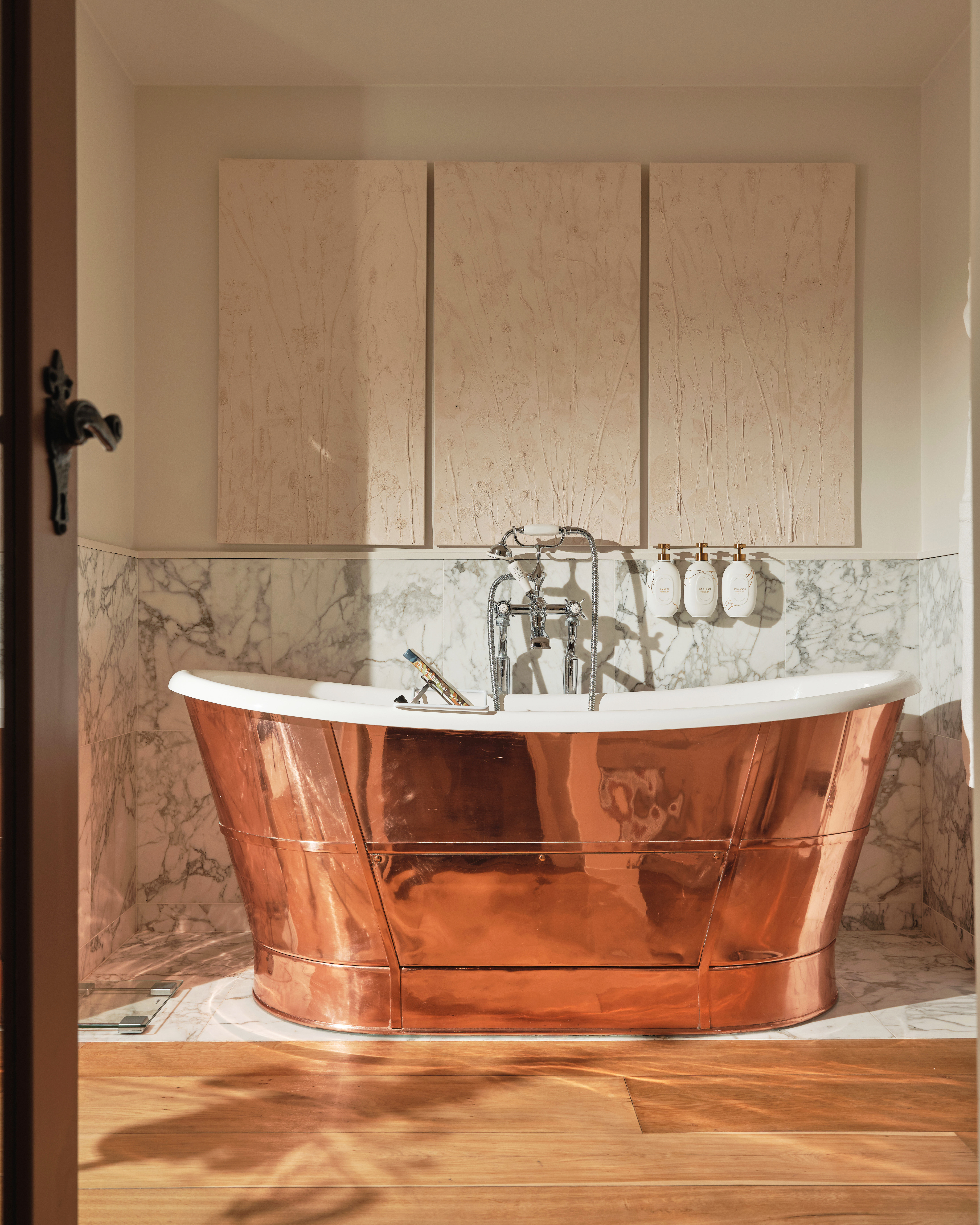Dower House Master Bathroom with copper roll top bath at Coworth Park 