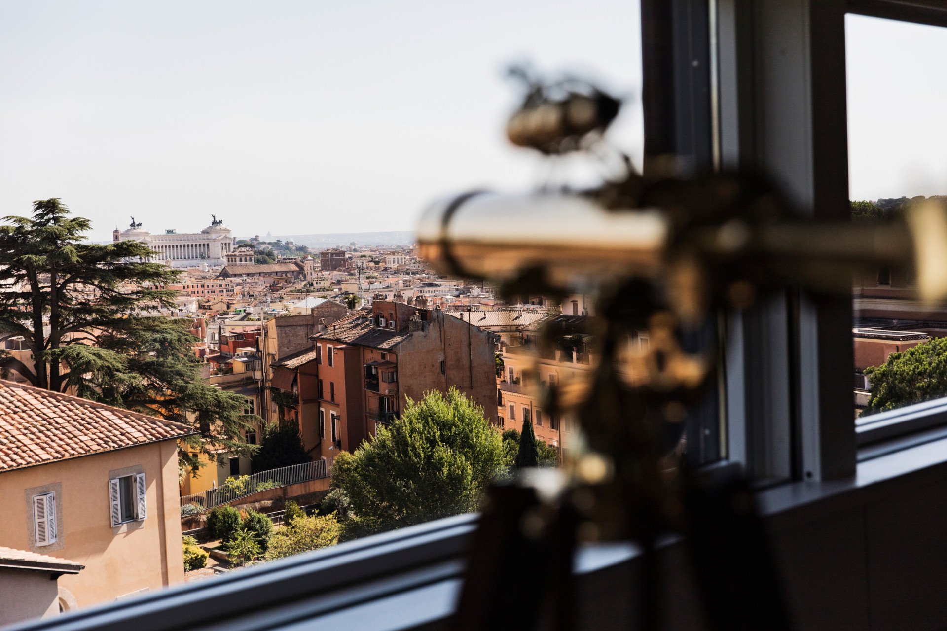 View of Rome and telescope inside Bellavista Penthouse Suite at Hotel Eden, Rome