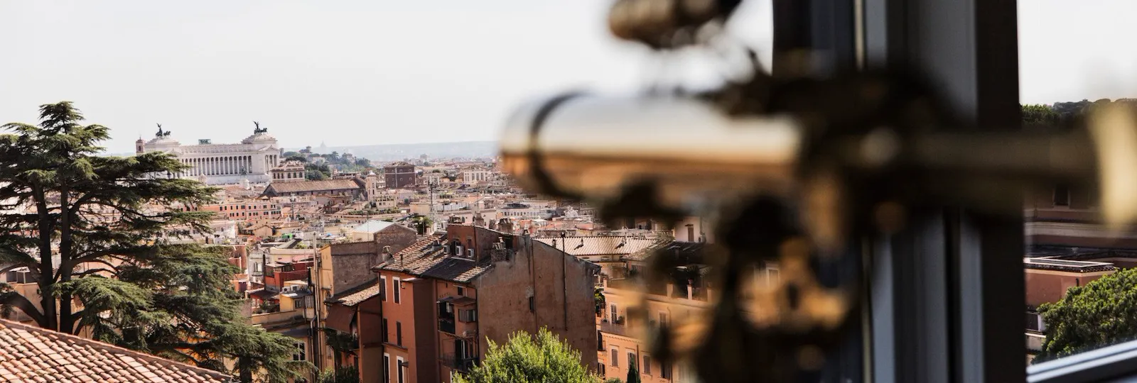 View of Rome and telescope inside Bellavista Penthouse Suite at Hotel Eden, Rome