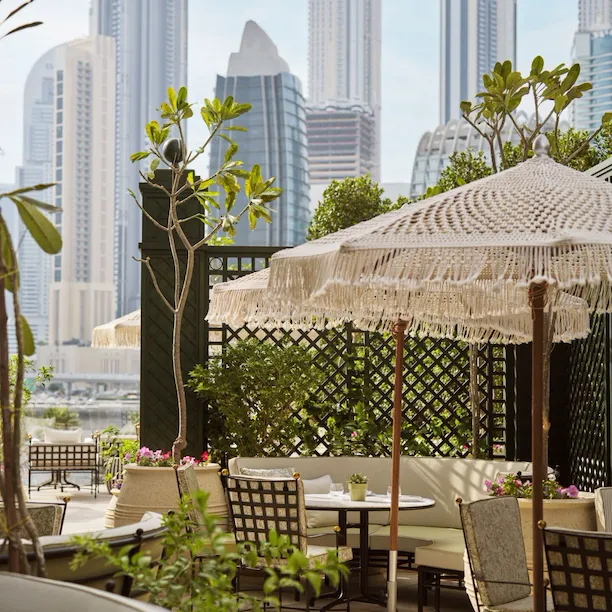 Image of Veranda design and food at The Lana - Dorchester Collection