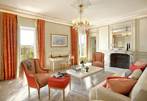 Executive suite living room with open doors to Tuileries garden view at Le Meurice, Paris