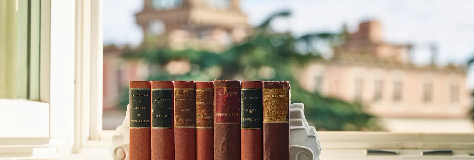 Books and view of Rome in the background at Junior Suite at Hotel Eden, Rome