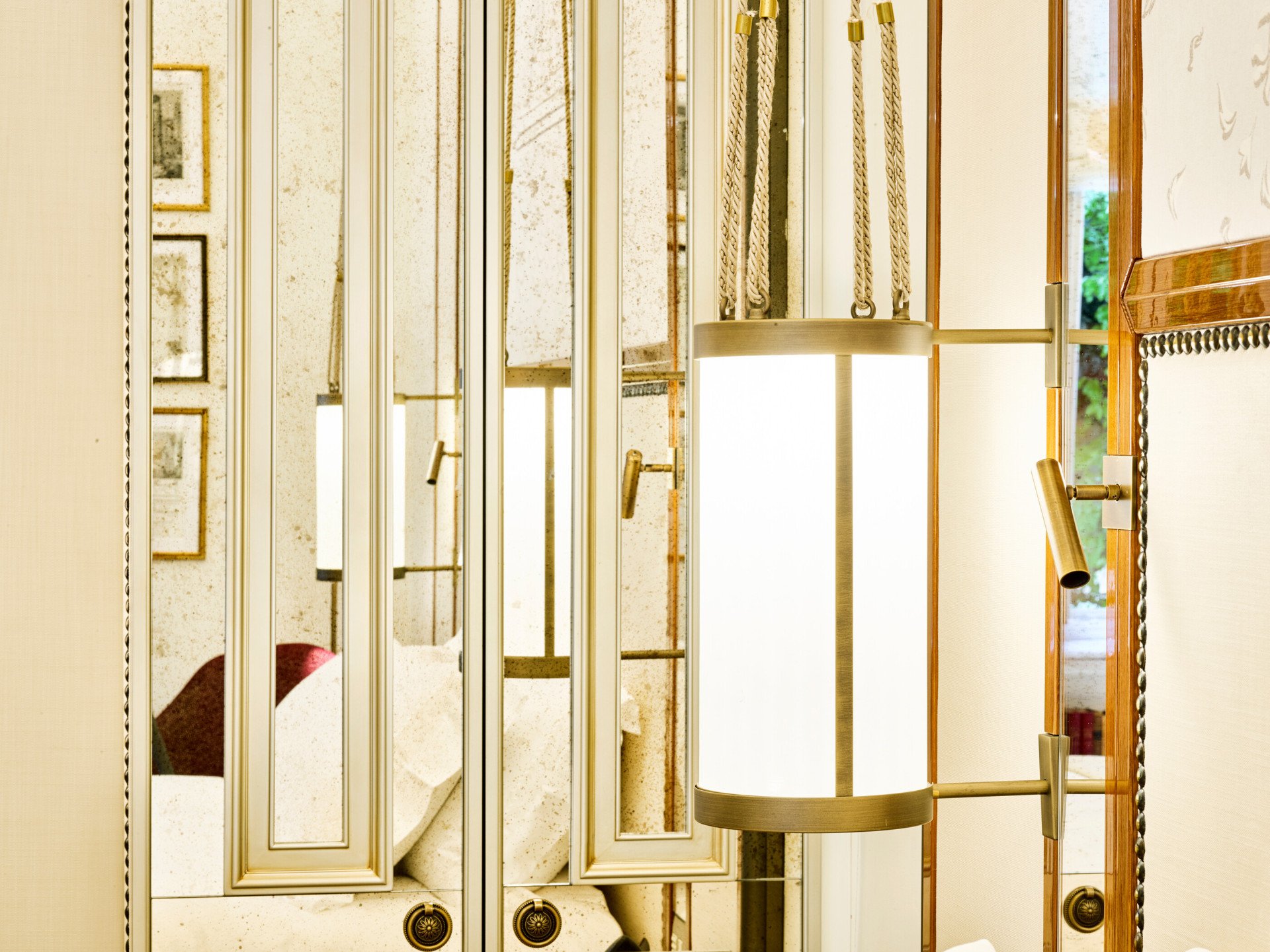 Lit lamp and wardrobe inside bedroom of Classic Suite at Hotel Eden, Rome