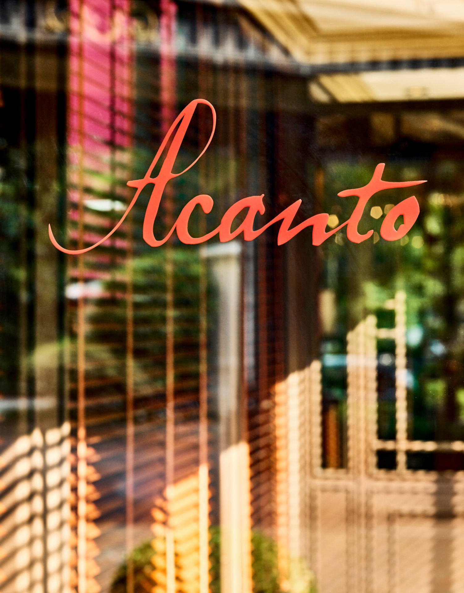 View of Acanto restaurant external door with Acanto sign in red