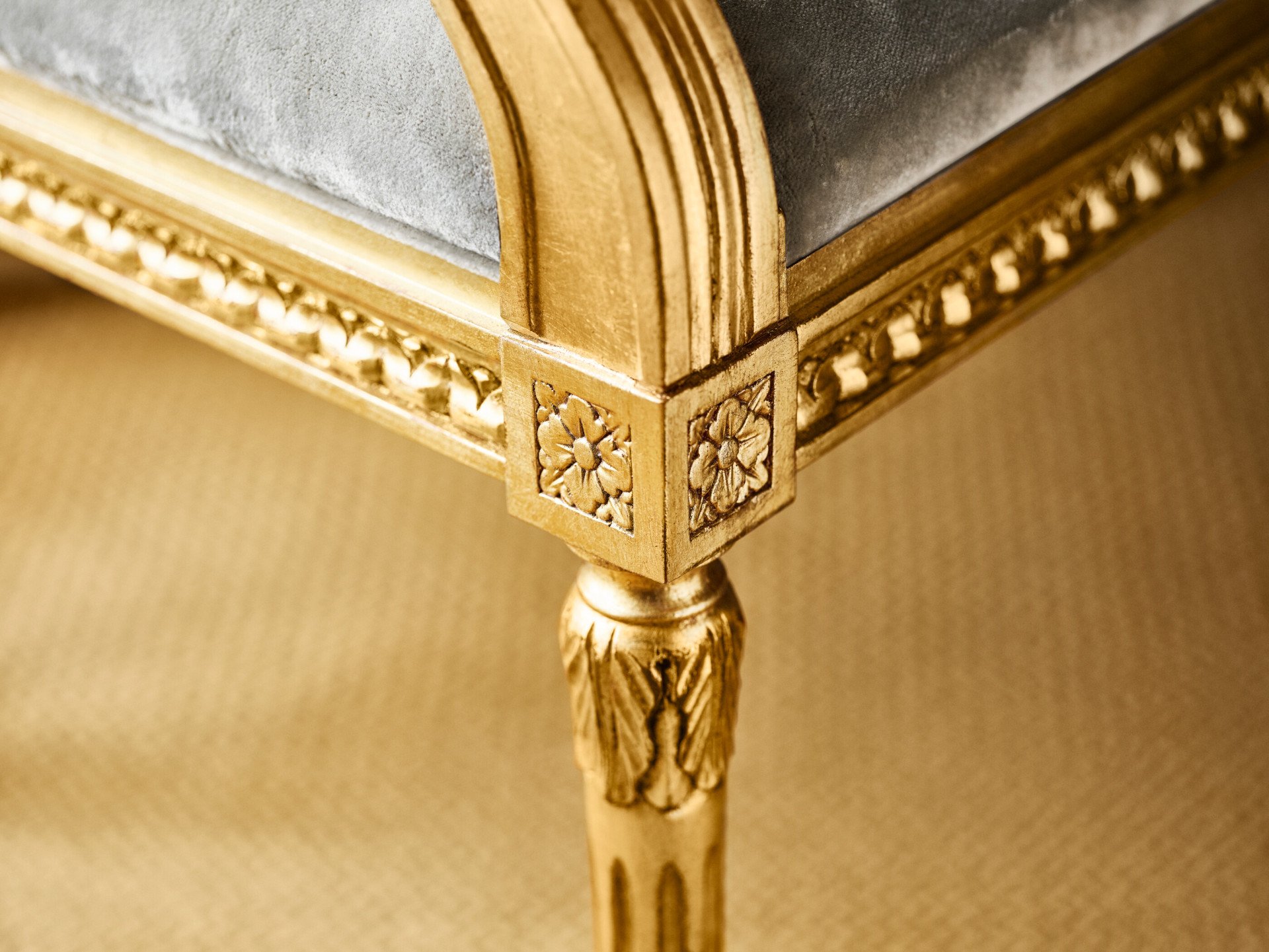 Detail of grey and golden armchair at Classic Suite at Hotel Eden, Rome