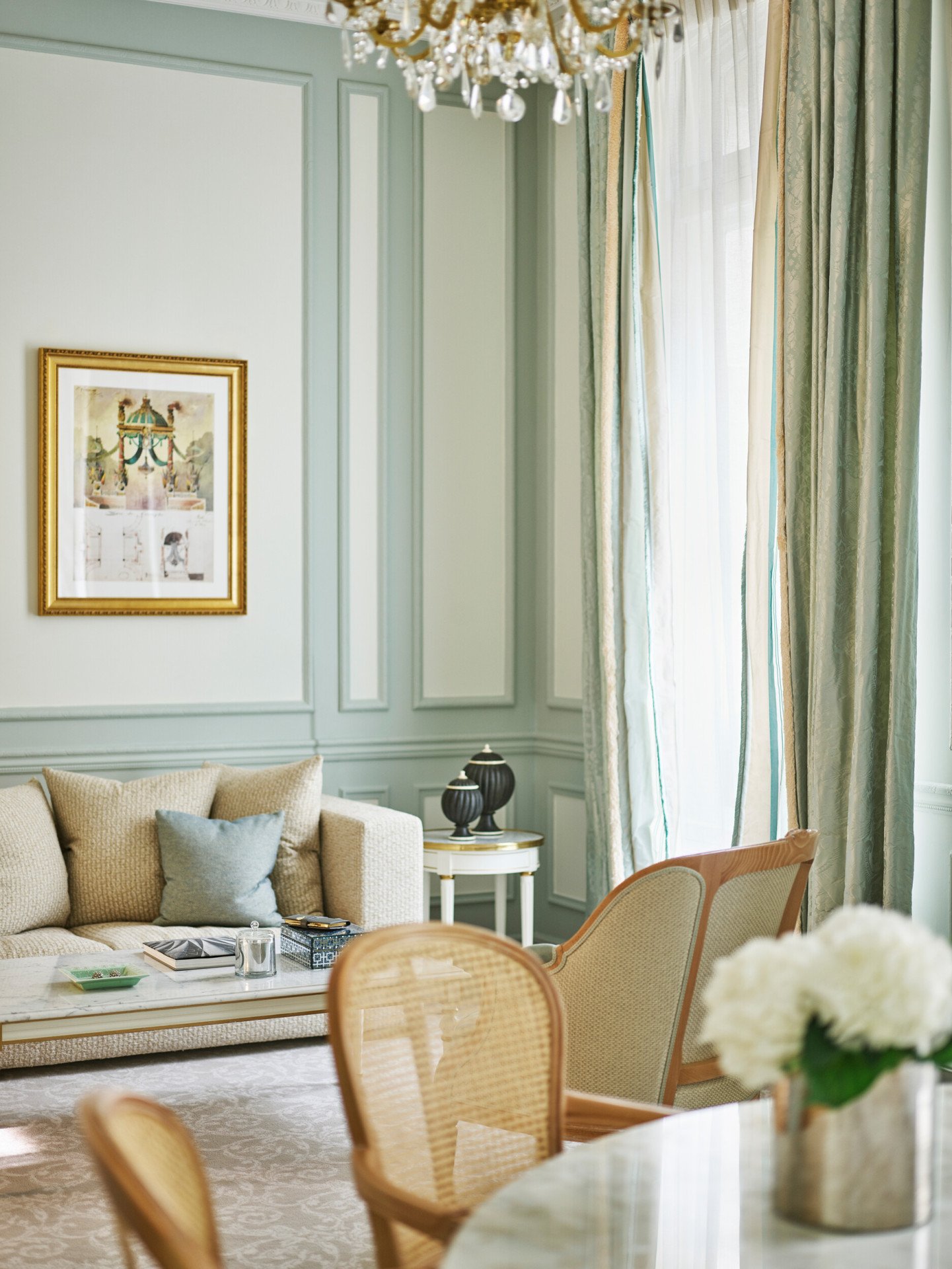 Closeup of chairs and the couch in the livingroom of a superior suite at Le Meurice, Paris.