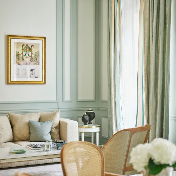 Closeup of chairs and the couch in the livingroom of a superior suite at Le Meurice, Paris.