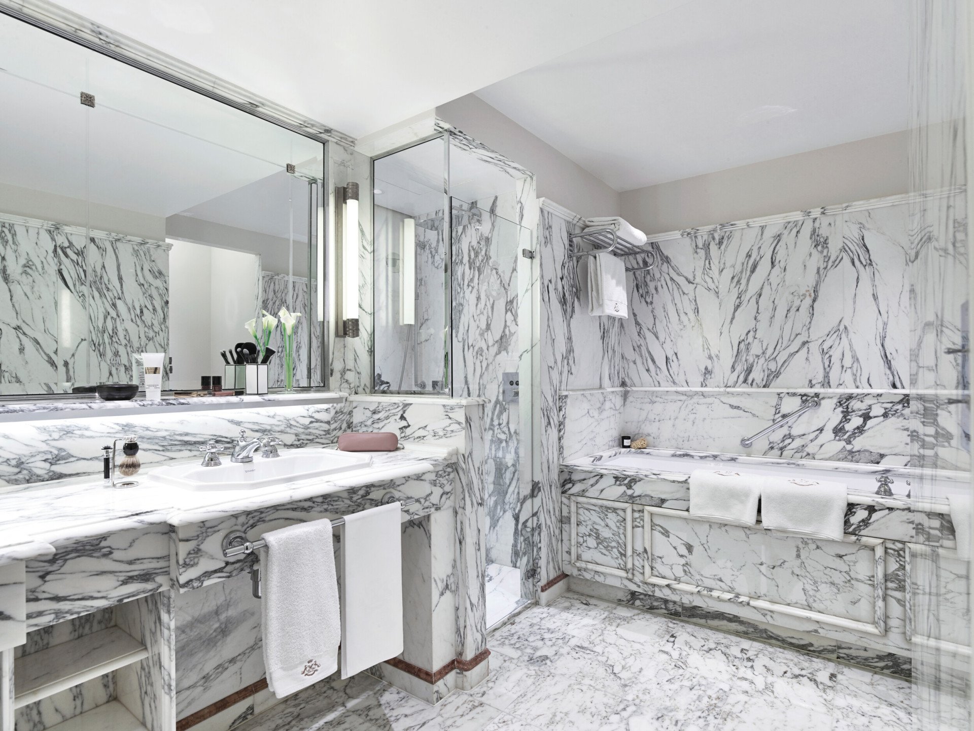 Marble bathroom in a superior room with balcony, with a bathtub. At Le Meurice, Paris.