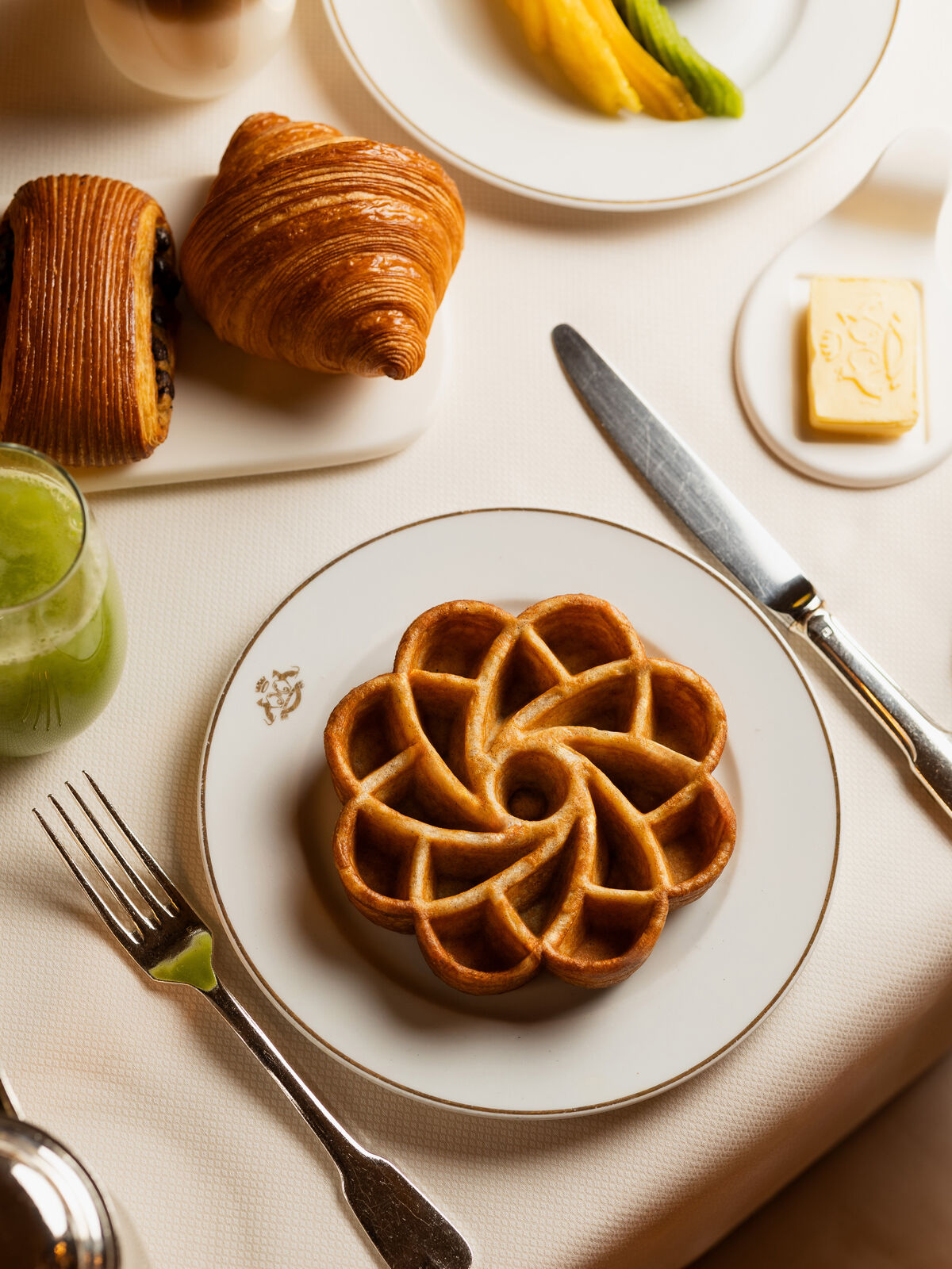 A flower-shaped waffle in a white plate
