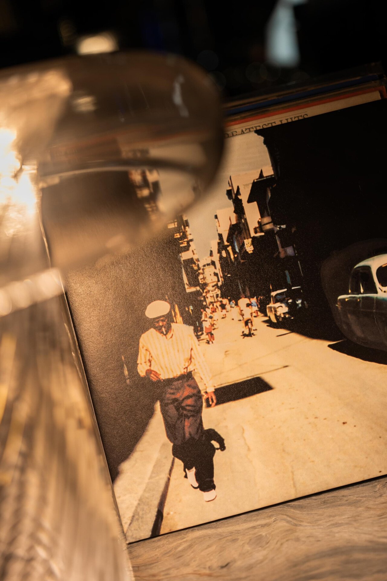 Images depicting Txakolina bar details at The Lana, Dorchester Collection, Dubai, including cigar, drink offerings and vinyl.