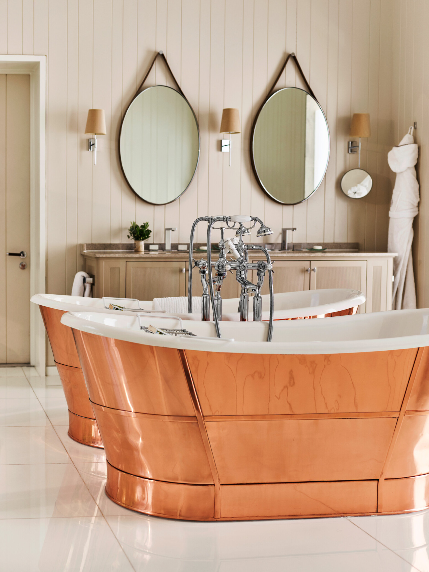 Coworth Park-Stable Premium Suite- bathroom with double copper roll top baths 