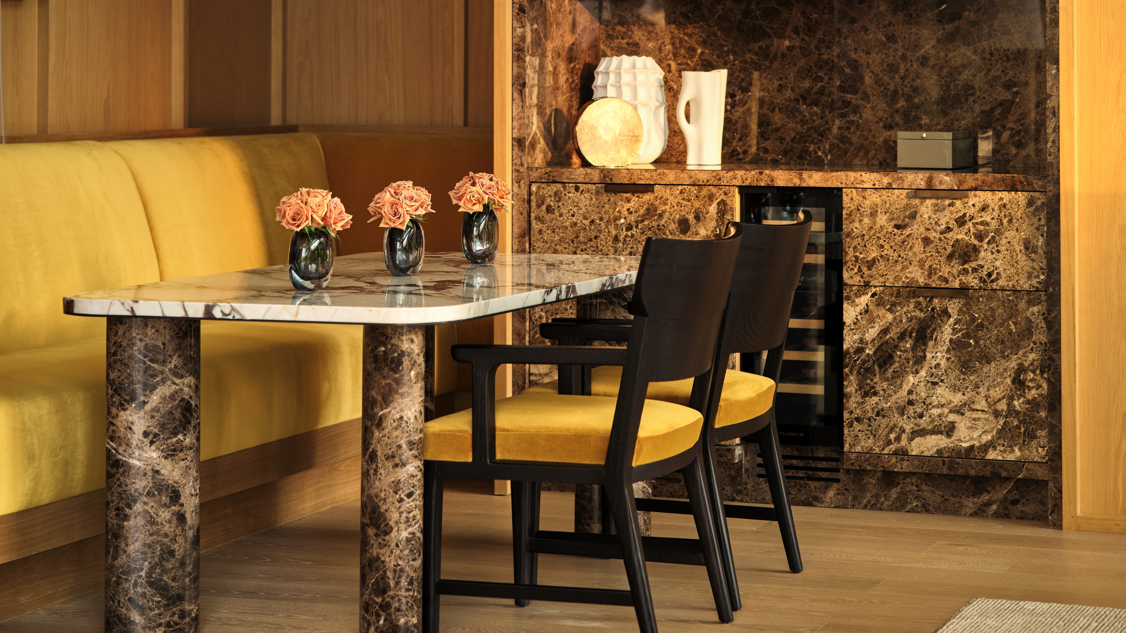 The marble dining table and the minibar's decoration in the Duplex Suite