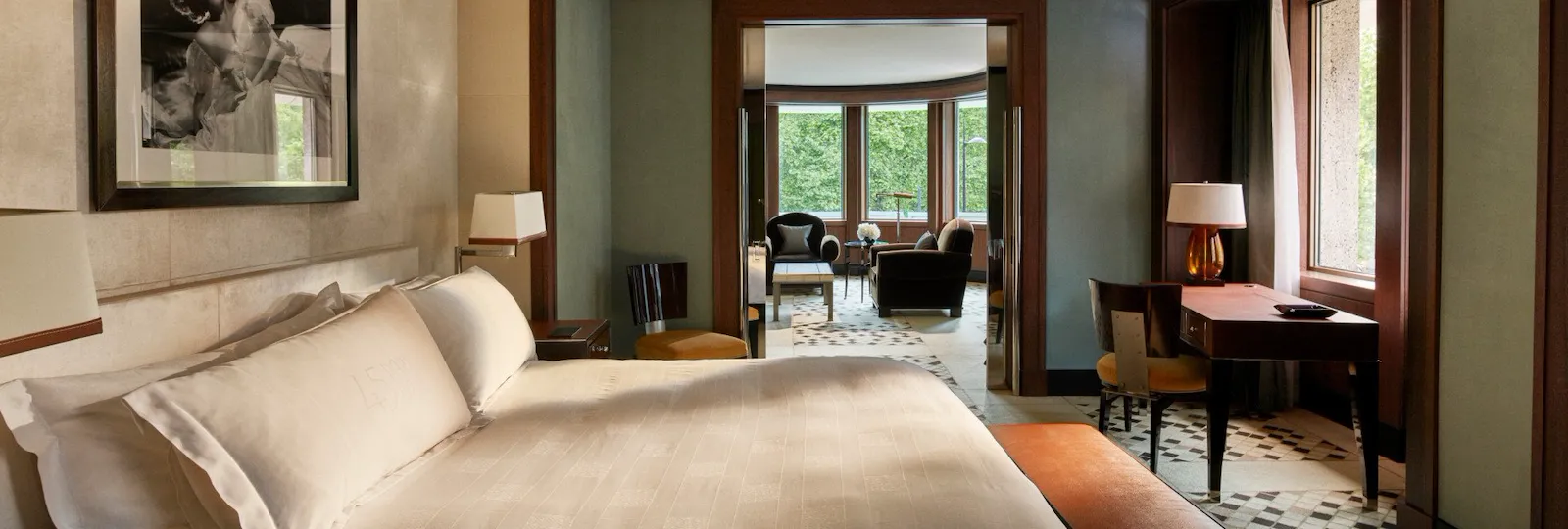 Park suite bedroom showing wrap around living room at 45 Park Lane, London