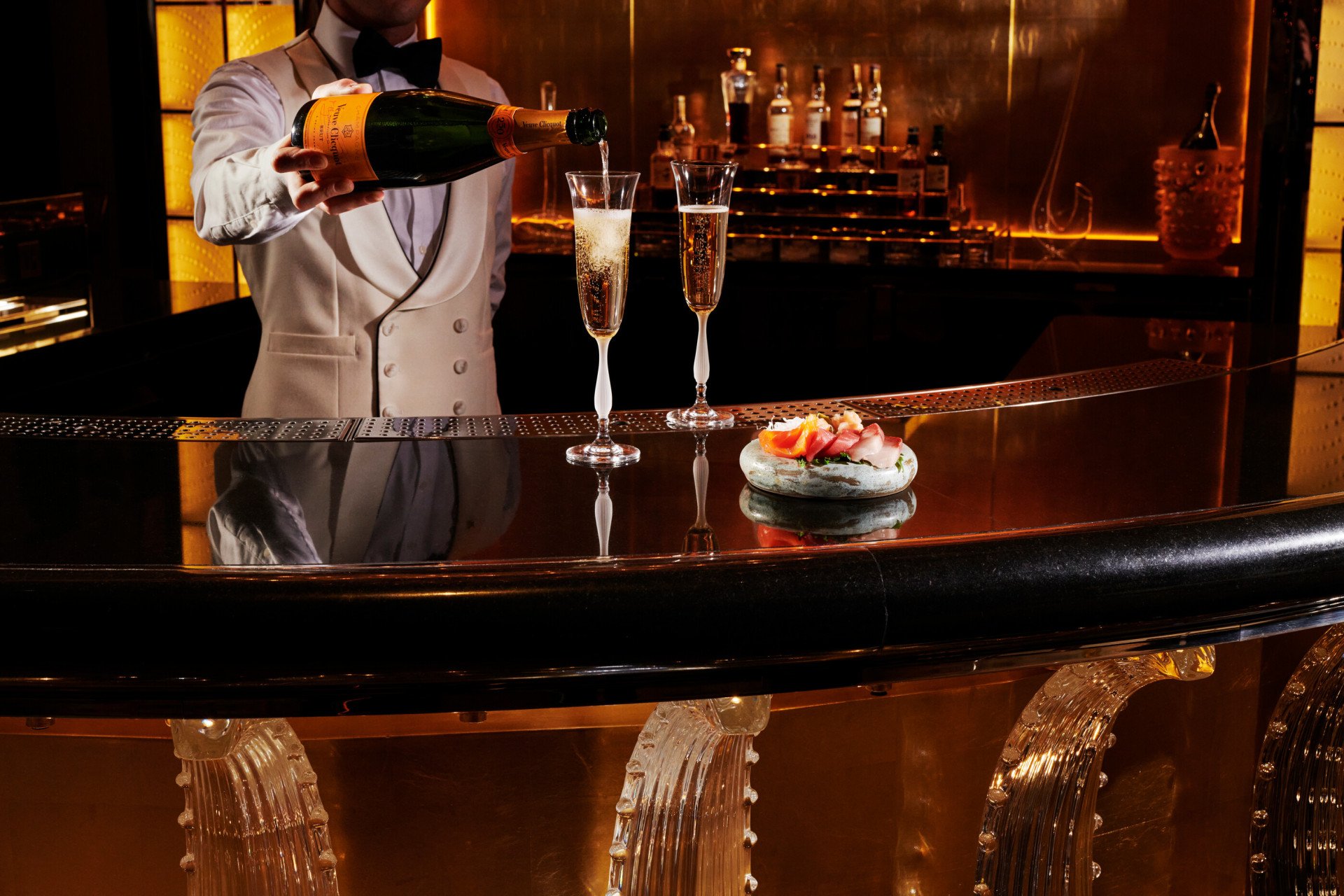 The bar counter at Artists' Bar with champagne and seafood