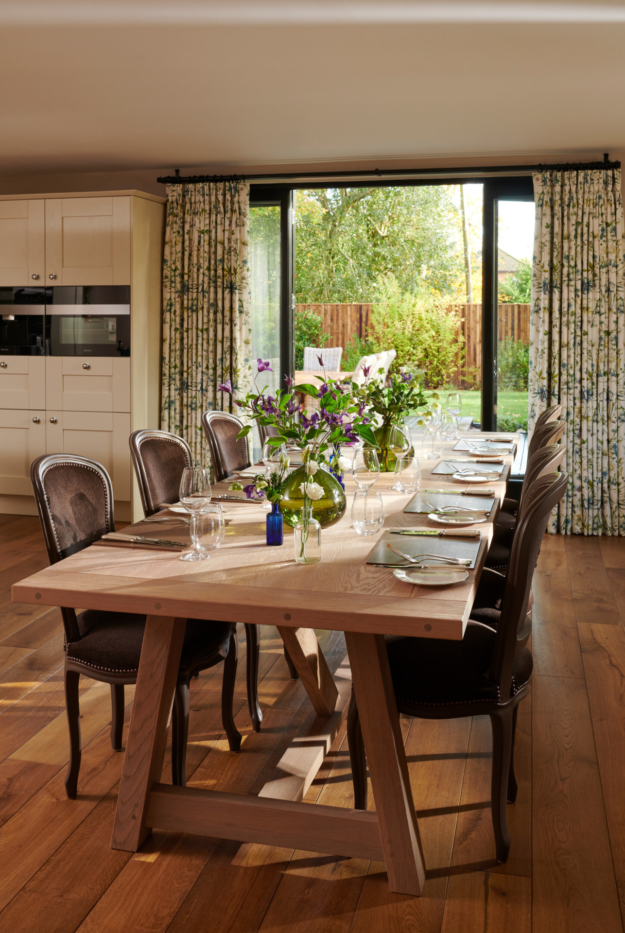 Coworth Park-North Lodge-Dining room set up with bouquets of purple and green flowers
