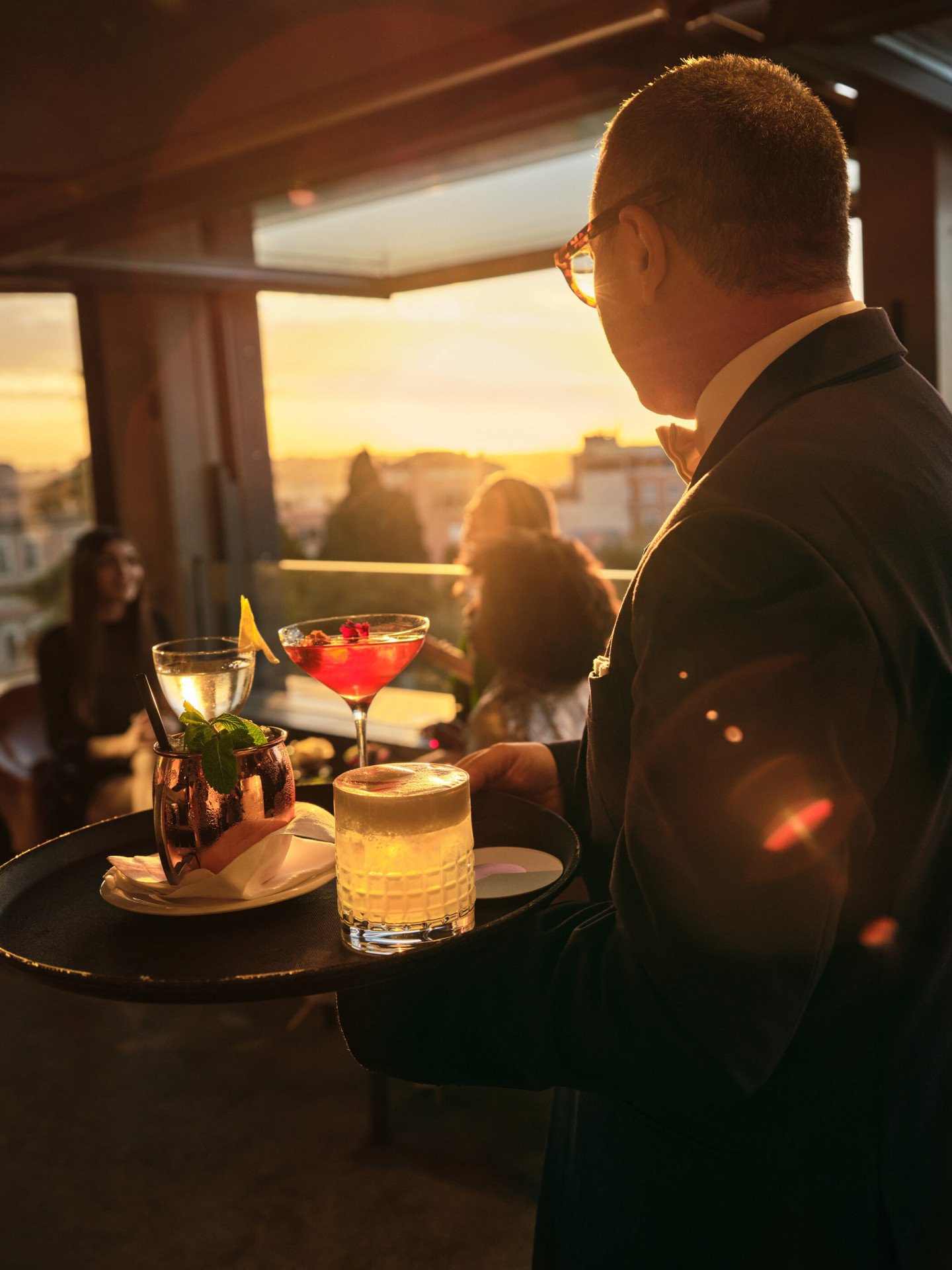 Barman serving drinks at Il Giardino Bar