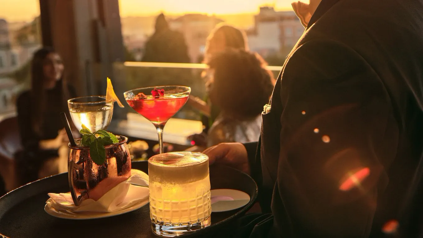 Barman serving drinks at Il Giardino Bar