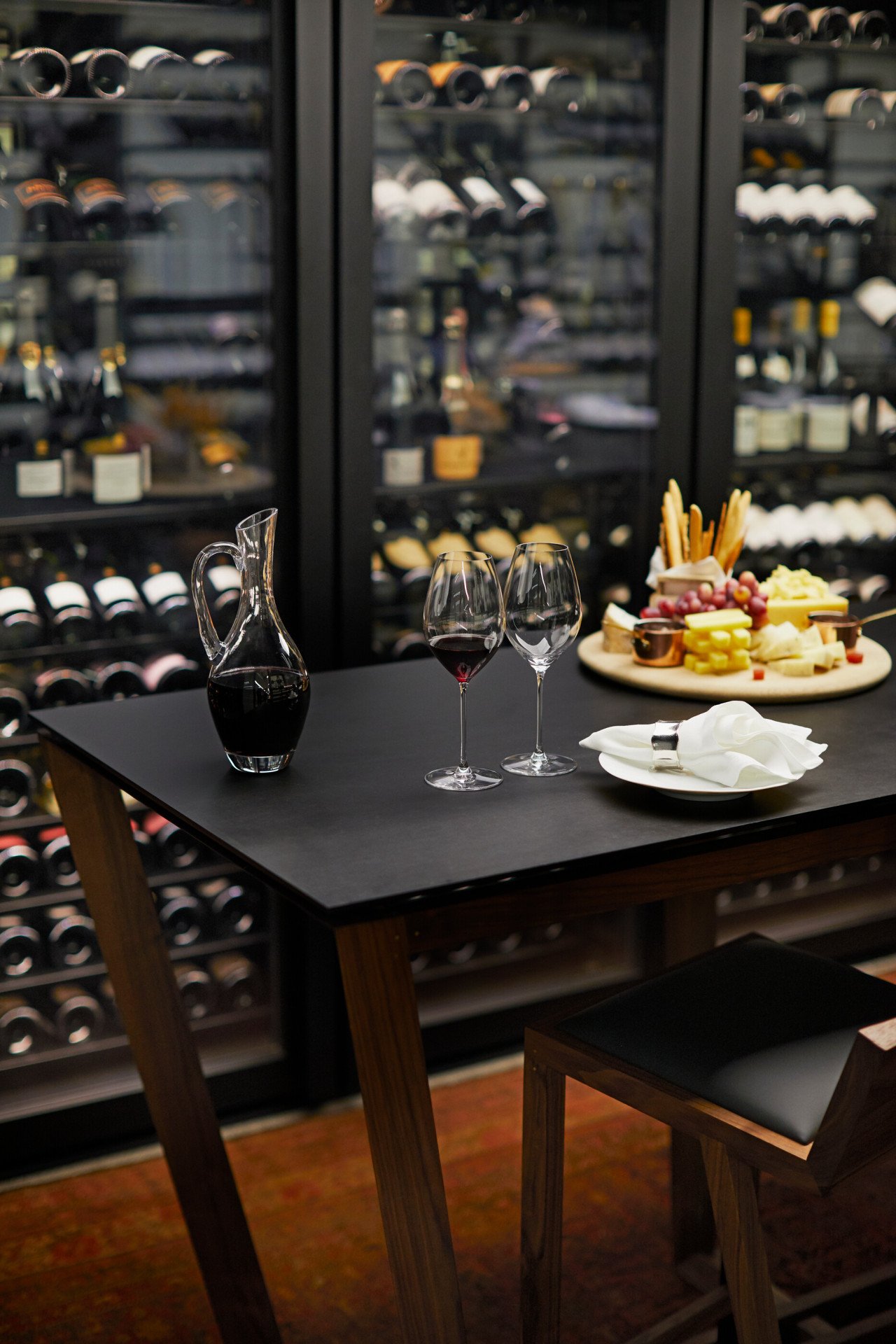 The Dorchester The Wine Vault,  red wine being poured and cheese and fruit