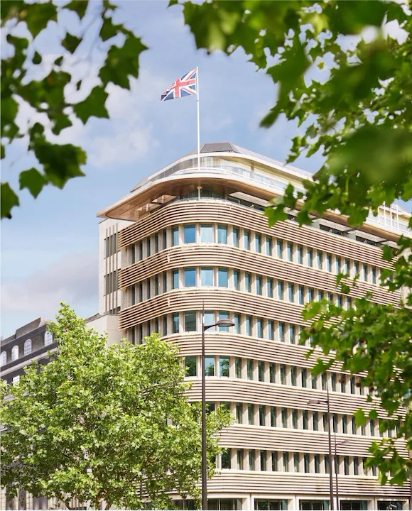 Exterior facade of 45 Park Lane London on a sunny day from Hyde Park, London