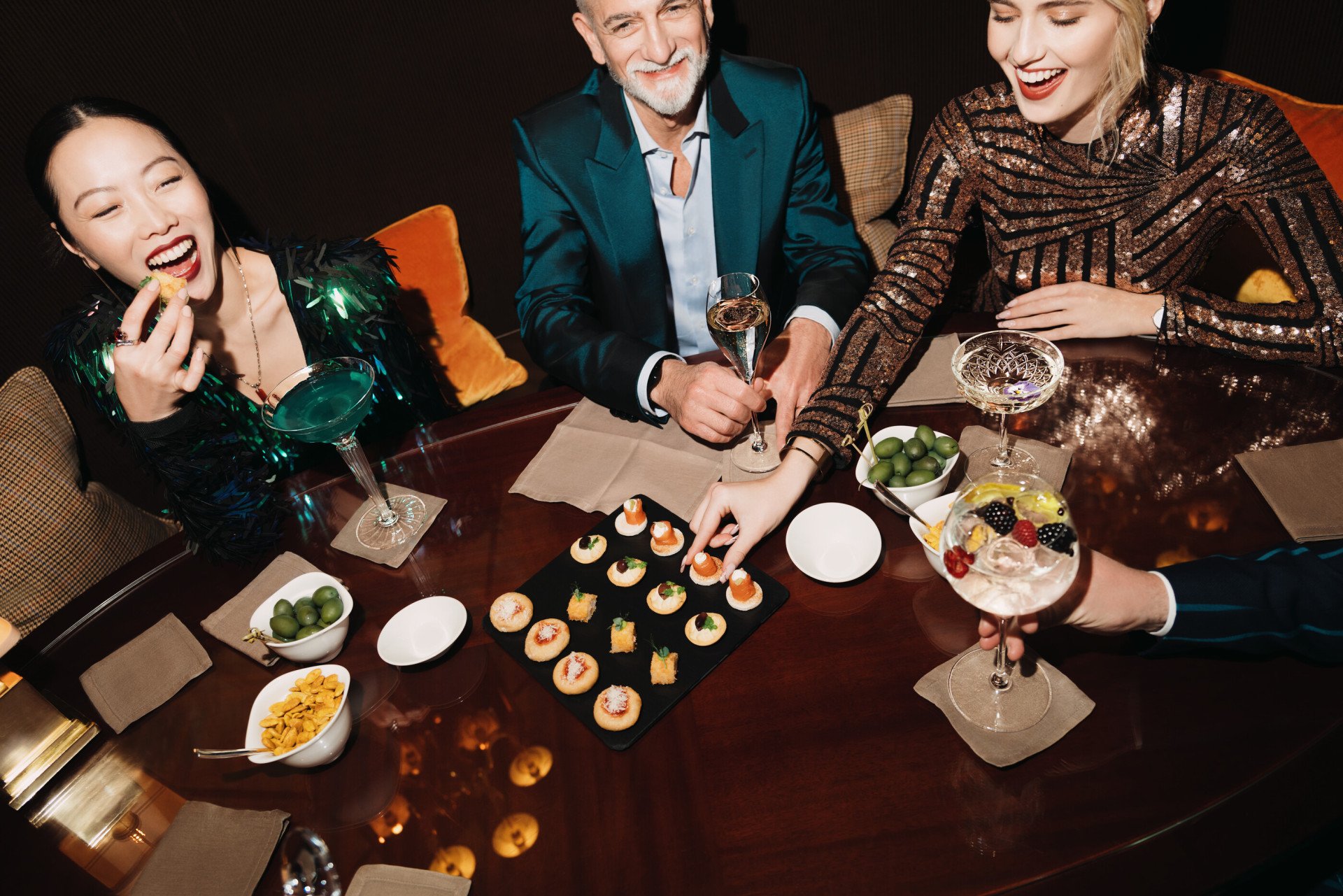 People eating canapes and drinking cocktails at Principe Bar 