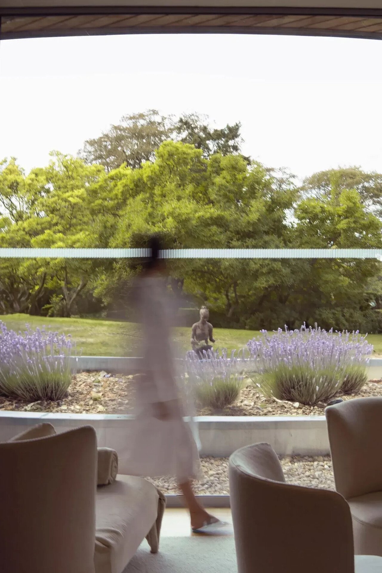 Model walking through relaxation room at The Spa at Coworth Park