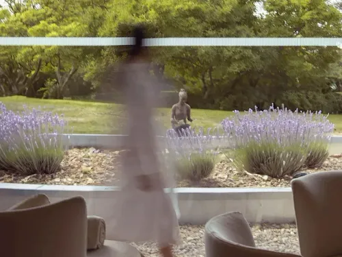 Model walking through relaxation room at The Spa at Coworth Park