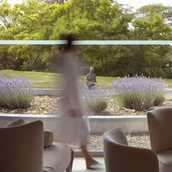 Model walking through relaxation room at The Spa at Coworth Park