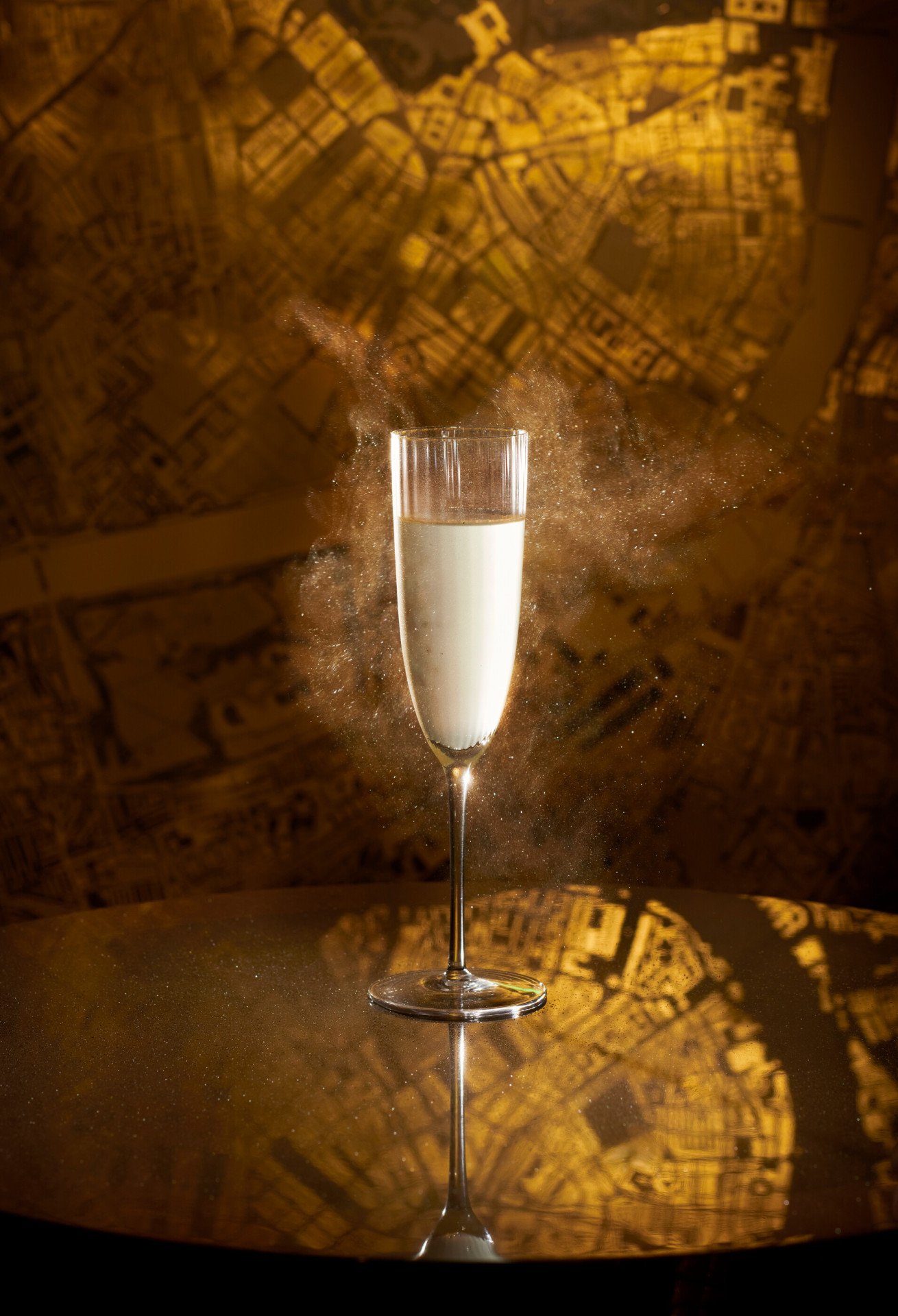 Signature cocktail at Artists' Bar presented in front of its artwork