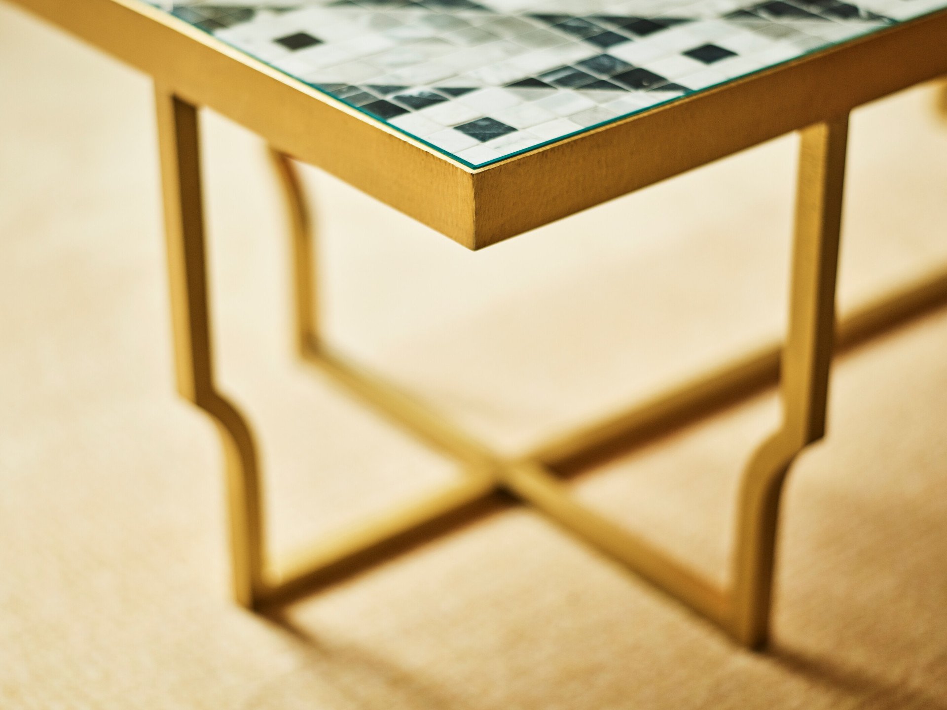 Detail of coffee table with golden base at Prestige Suite at Hotel Eden, Rome