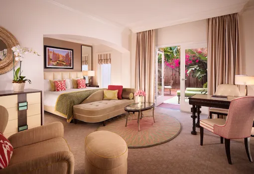 Deluxe guestroom with patio, desk and seating area