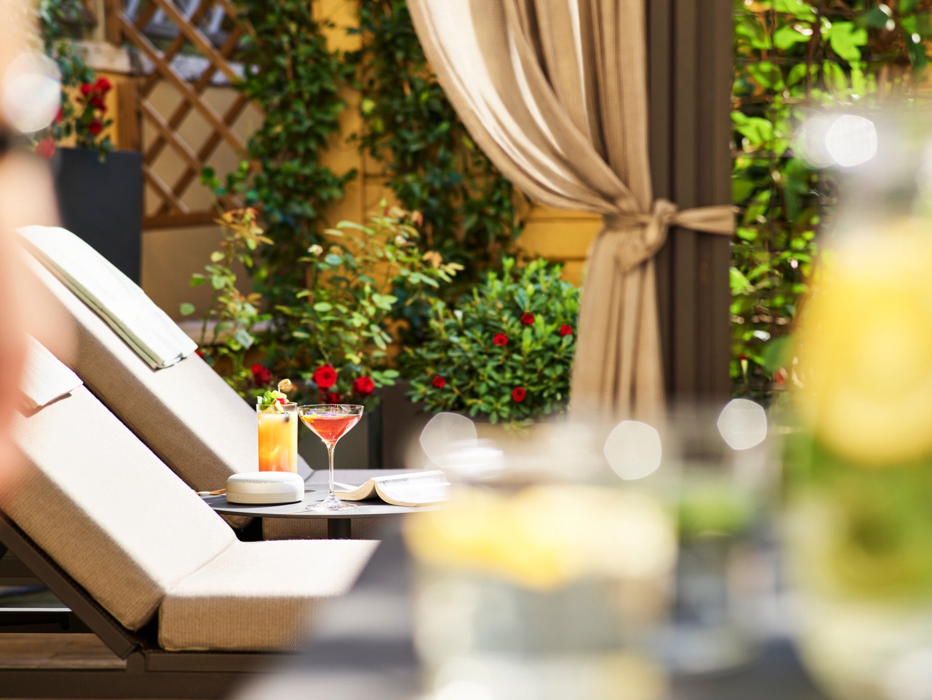 Sunbeds and two cocktails at sunny Aurora Terrace Suite at Hotel Eden, Rome