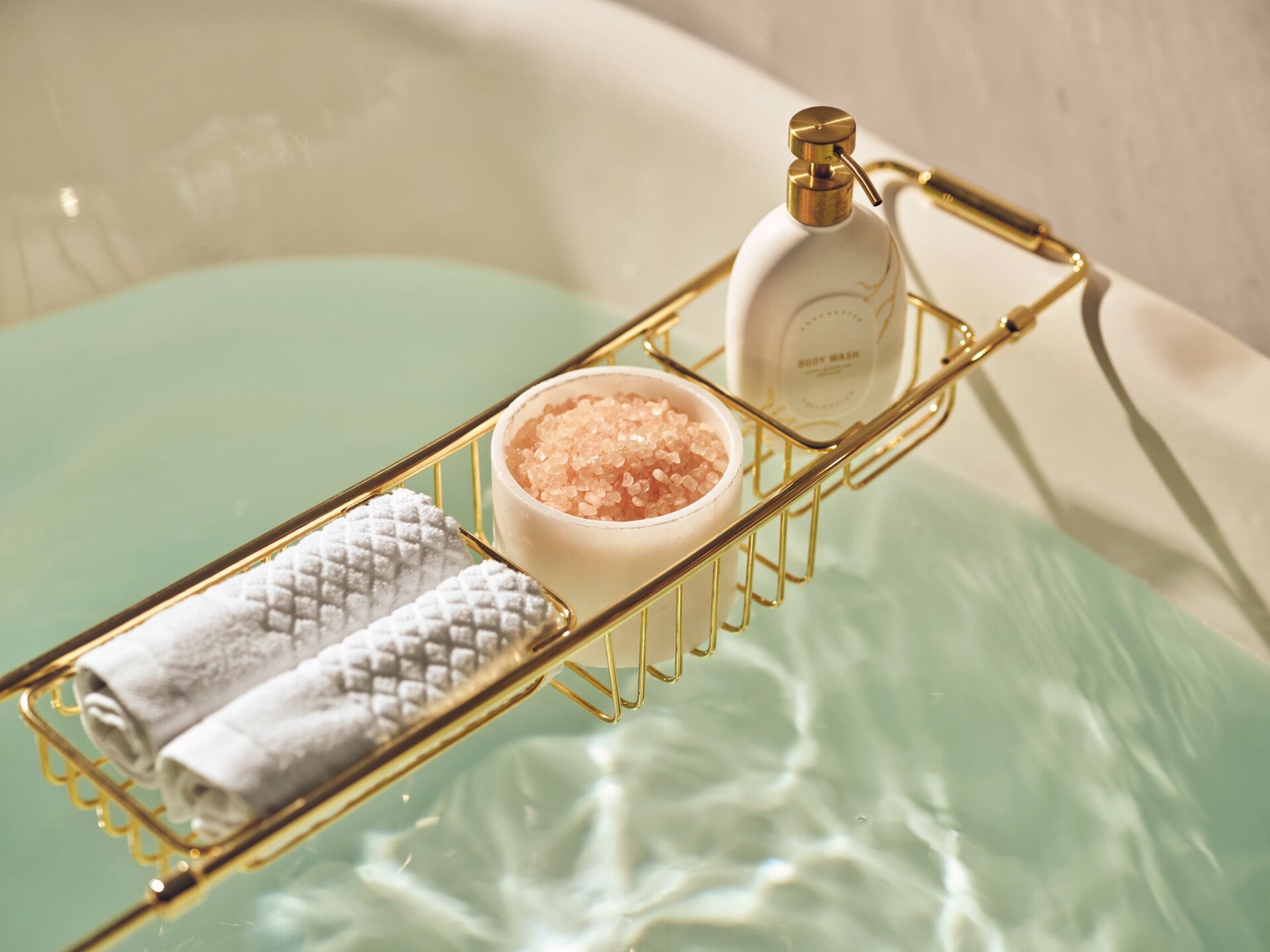 Bathtub details like bath salts, soap and towels.