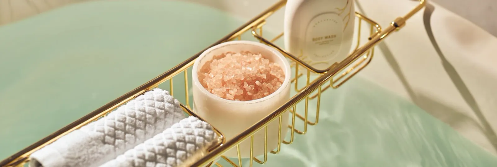 Bathtub details like bath salts, soap and towels.