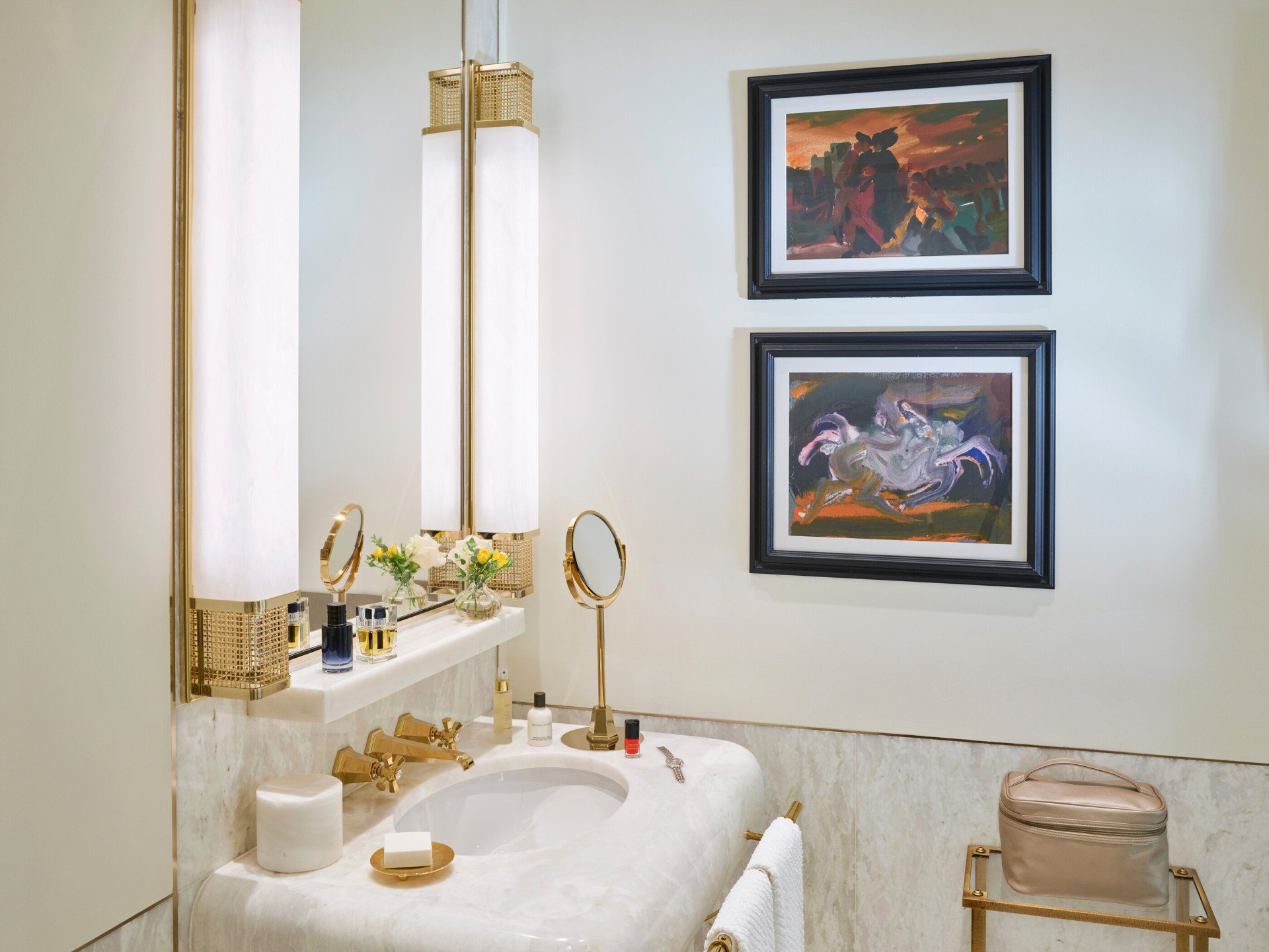 Bathroom of classic room with white marble sink and paintings at Hotel Eden, Rome