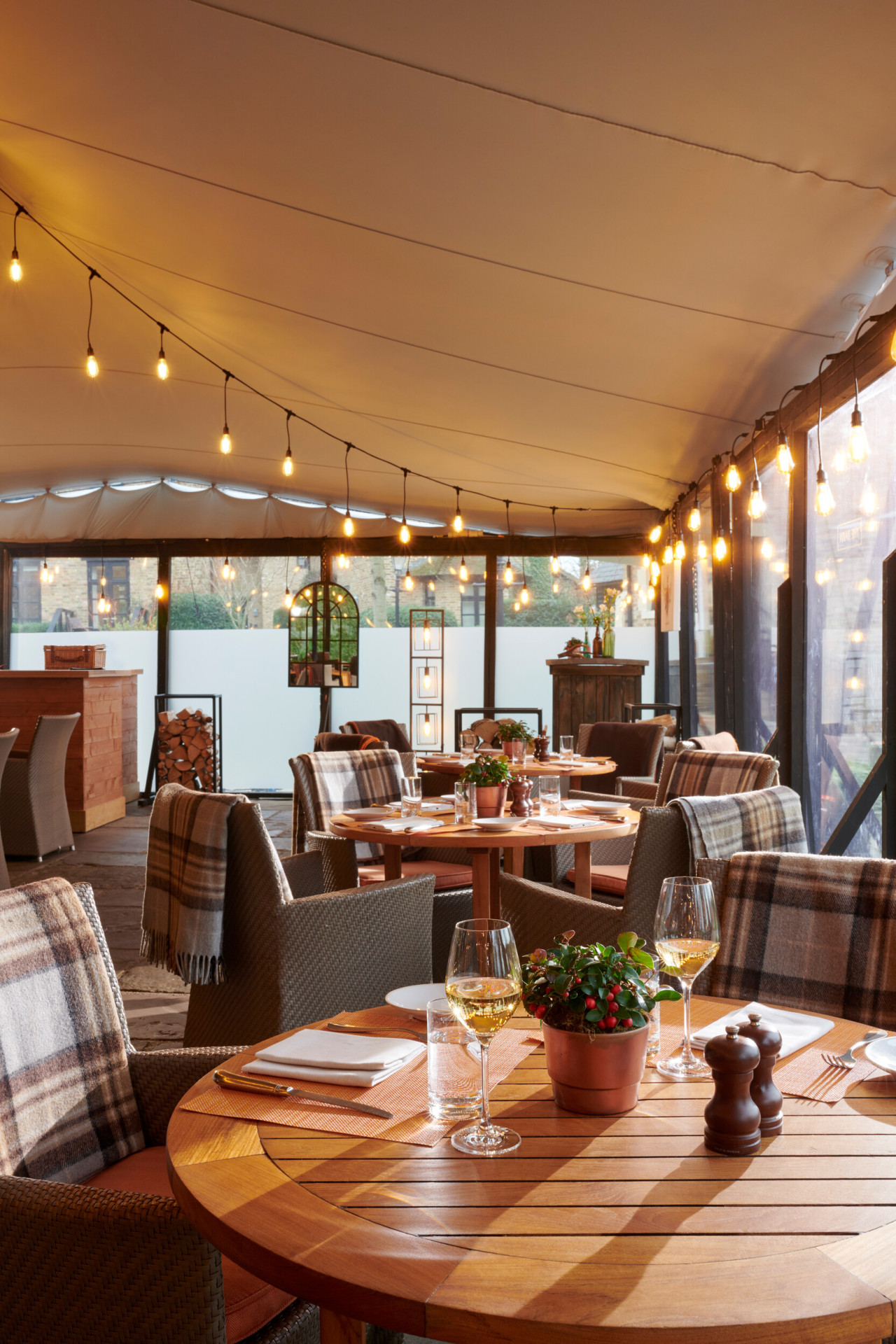 Coworth Park, The Barn, winter, terrace room dressed for dinner service with winter light 