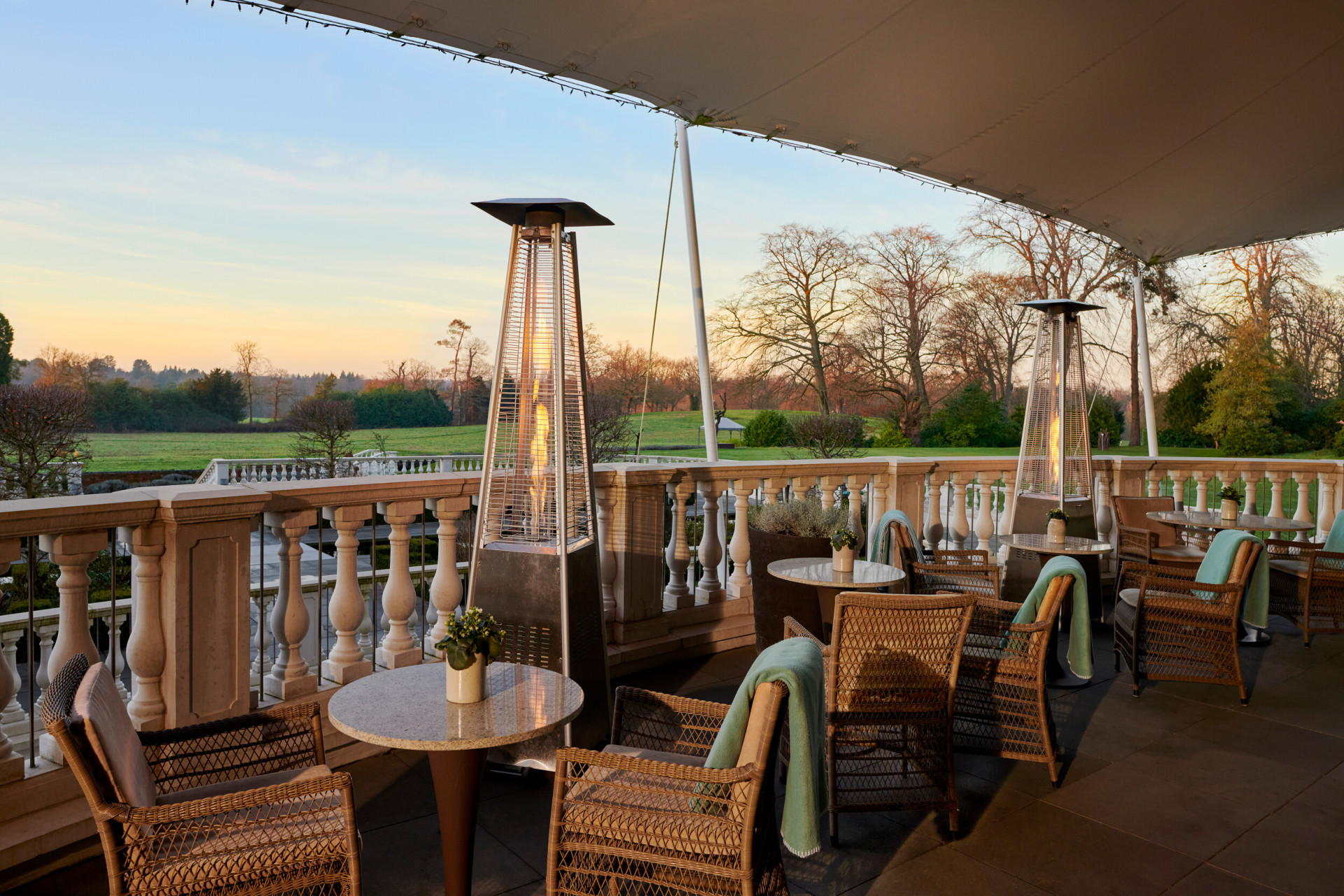 Coworth Park Drawing Room terrace with views of the winter countryside