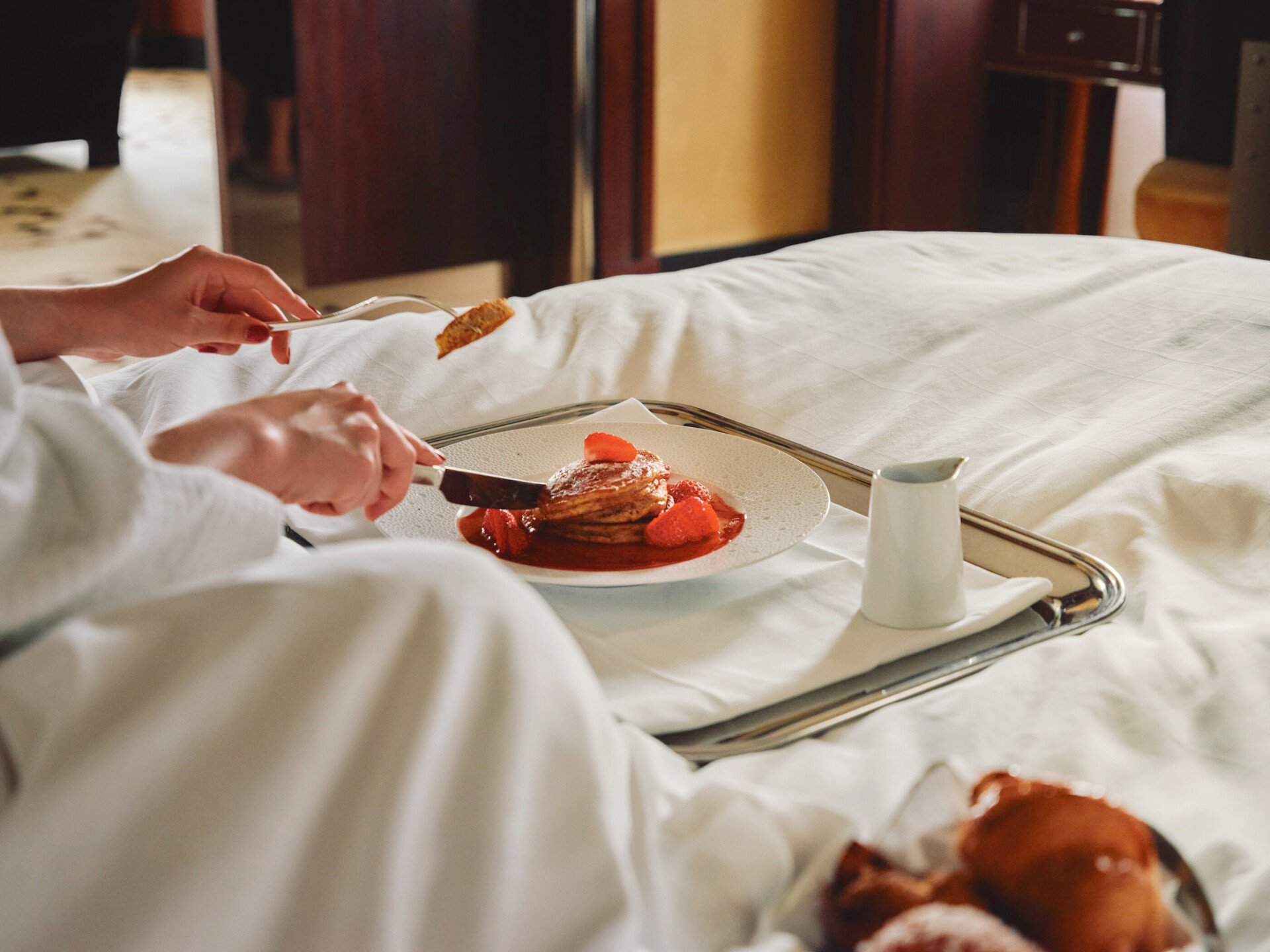 Woman looking out window of Park Lane Studio