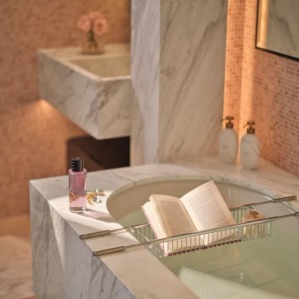 Images depicting The Lana Suite including living spaces, wardrobe and bathroom at The Lana, Dorchester Collection, Dubai.