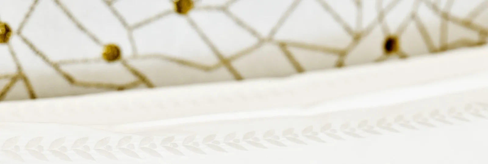 Detail of pillow with laurel leaves embroidery at Bellavista penthouse suite at Hotel Eden, Rome