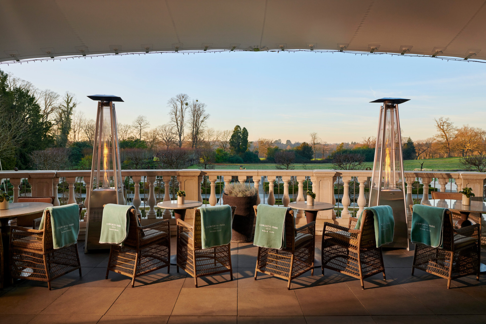 Coworth Park Drawing Room terrace with views of the winter countryside
