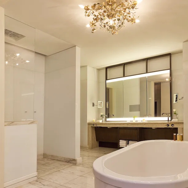 Deep soaking tub in marble bathroom of Loft Studio in Bel Air