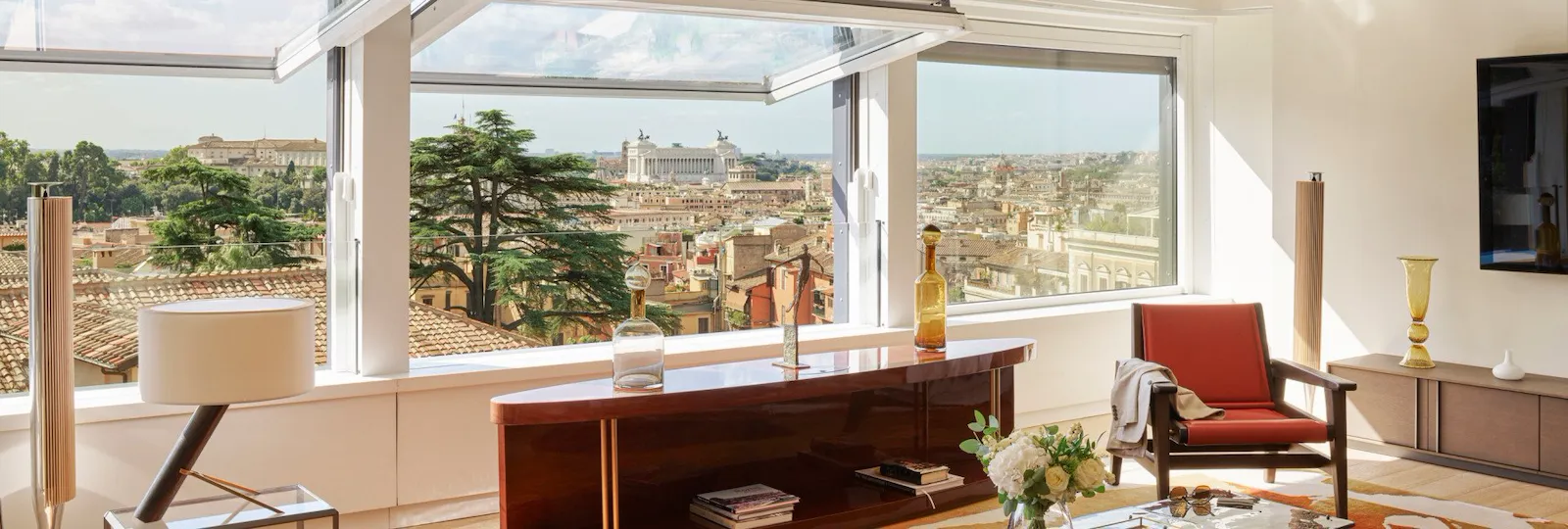 Bellavista Penthouse Suite living room with windows open and view at Hotel Eden, Rome