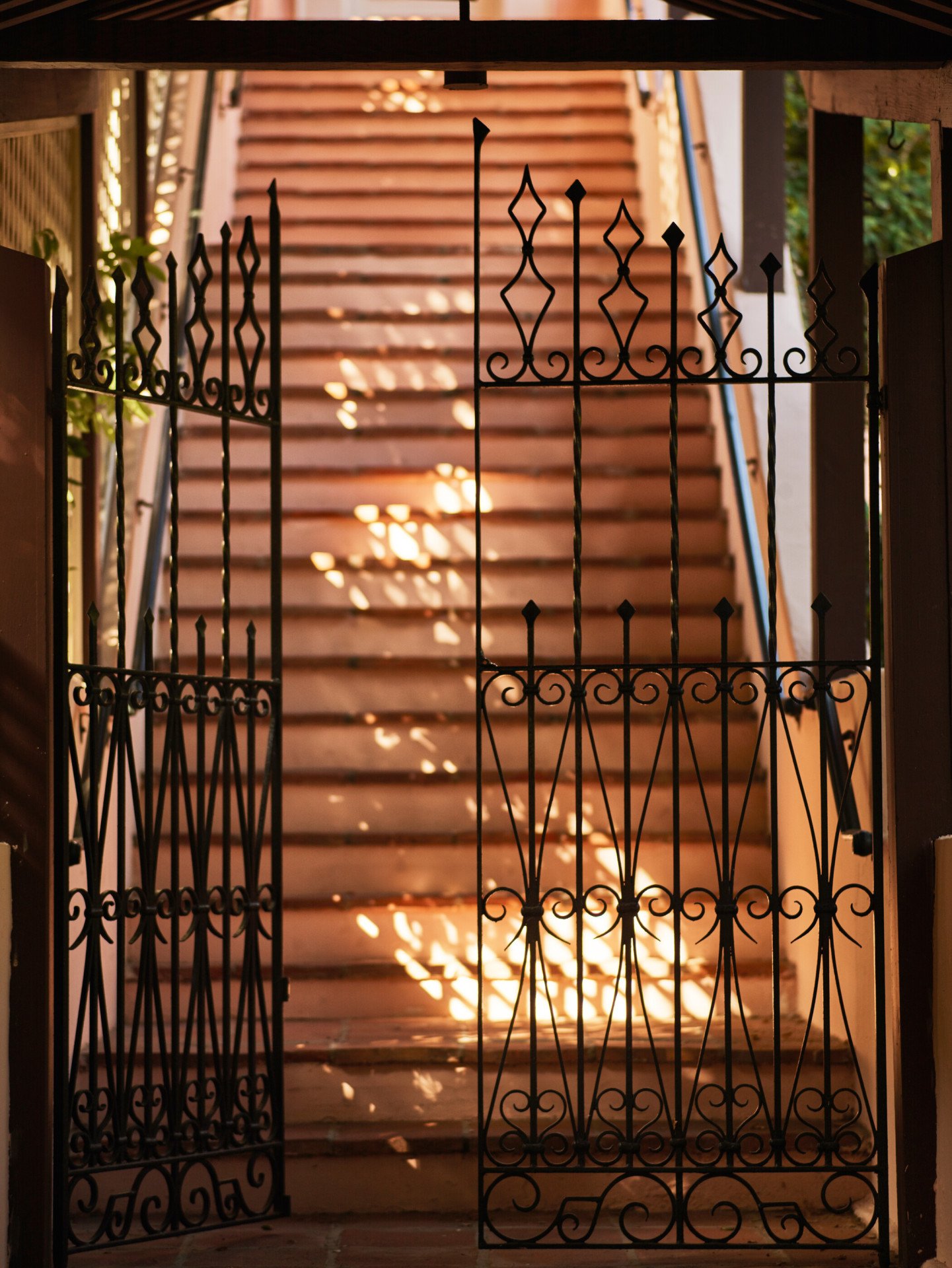 Gated entrance to stairway and The Bell Suite