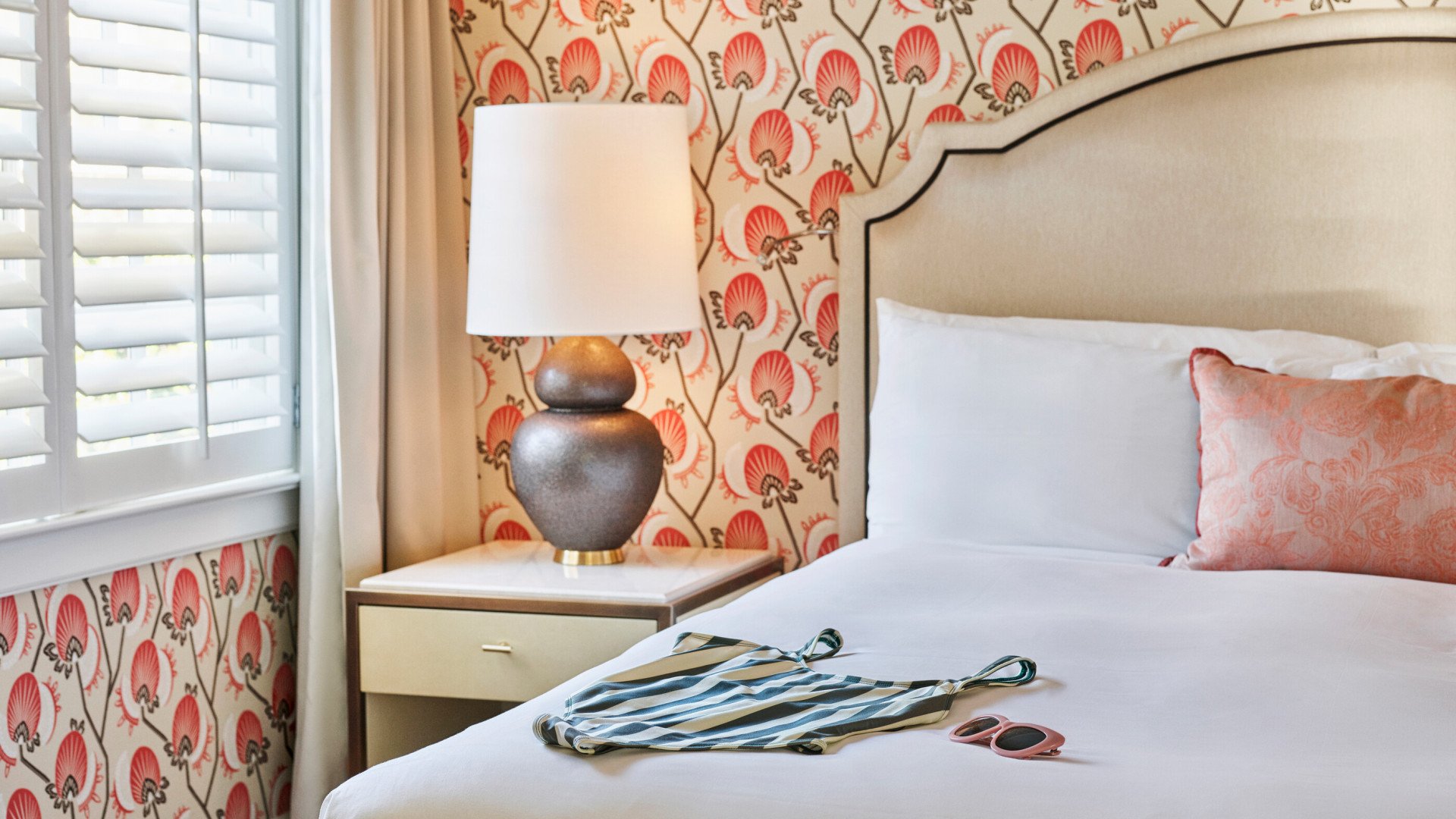 Bungalow Room with Patio Bedroom with Swimsuit and Glasses on Bed