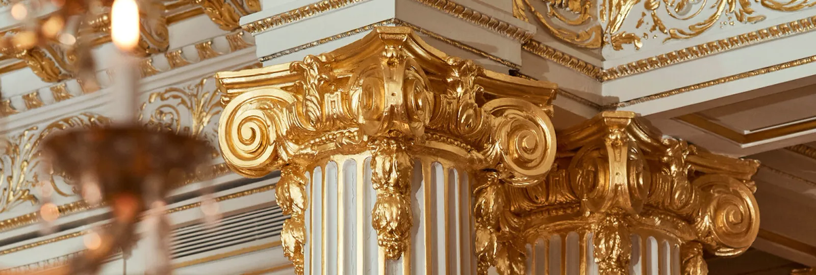 Golden columns of the Jean Imbert au Plaza Athénée dining room, at Hotel Plaza Athénée, Paris