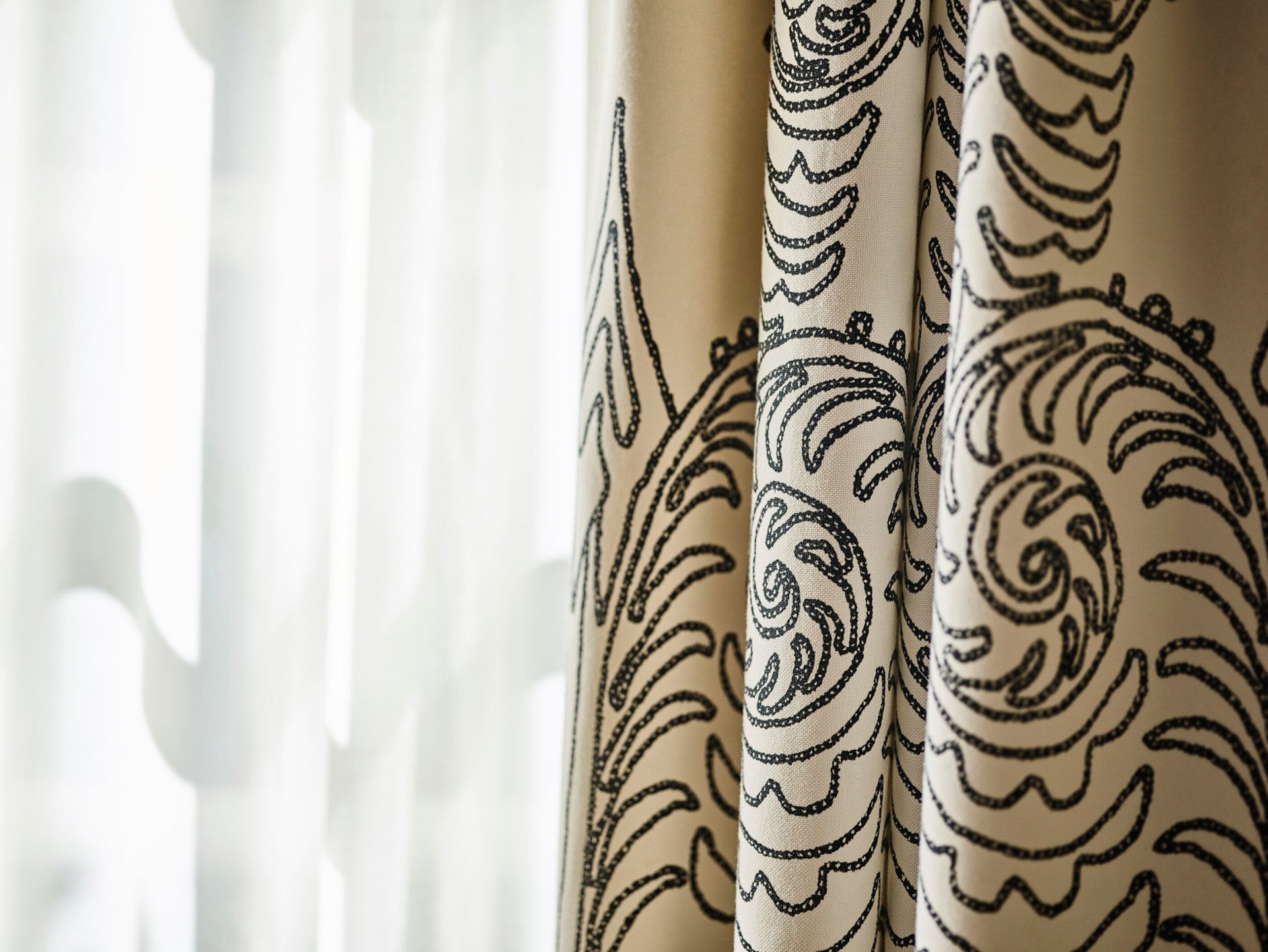 Sun shining through window with curtain closeup