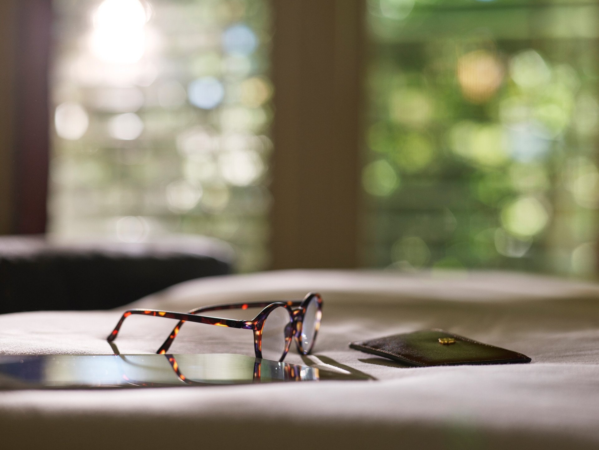 Moment of ipad, wallet and glasses at The Beverly Hills Hotel, Los Angeles 