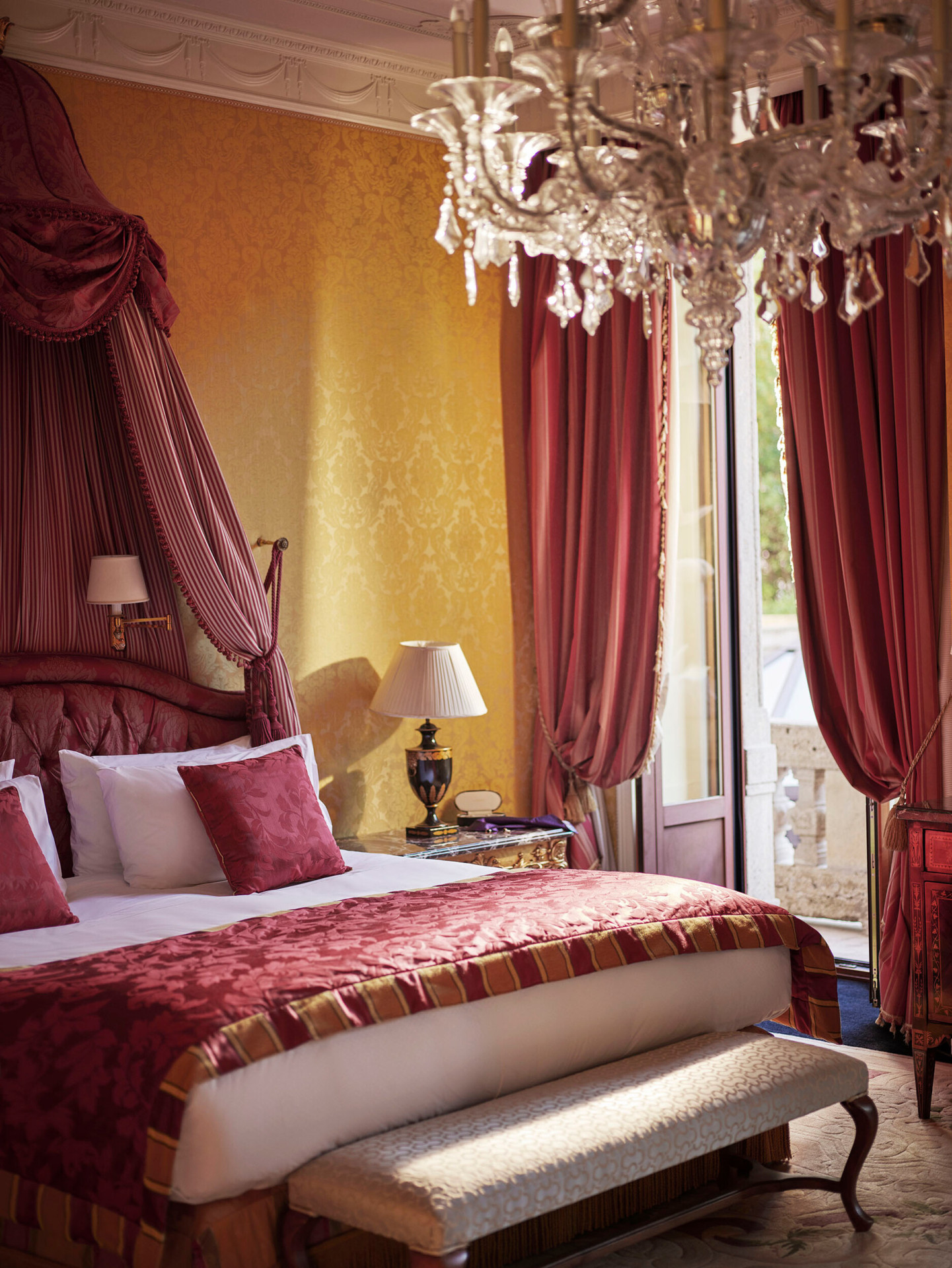 Royal Suite Bedroom Close-up showing the bed and the curtains decorated in red 