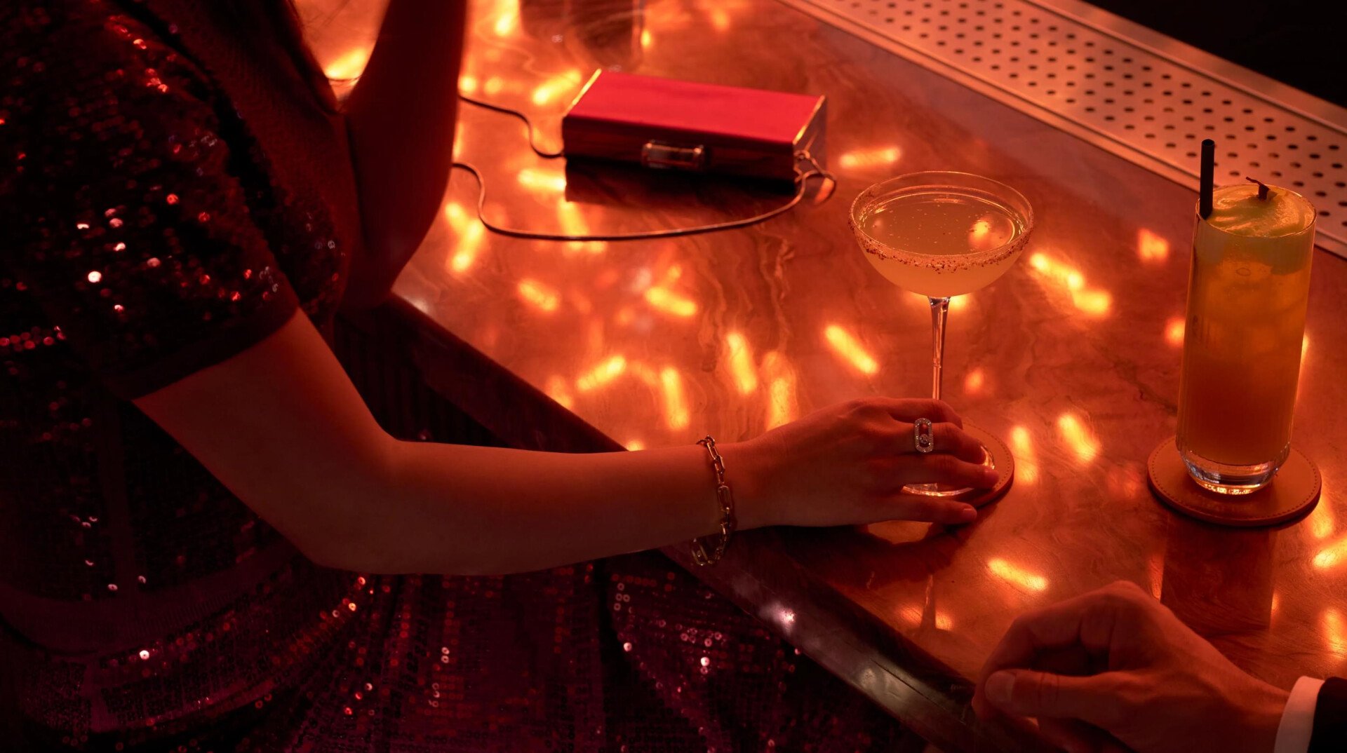 People drinking cocktails in the bar of Jara by Martin Berasategui